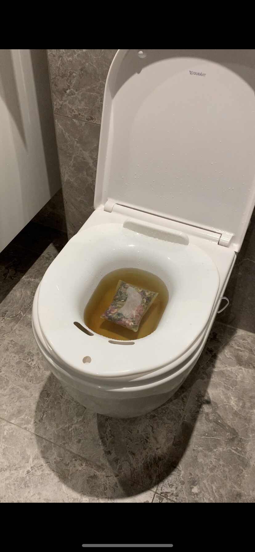 Yoni steam with herbs on the toilet
